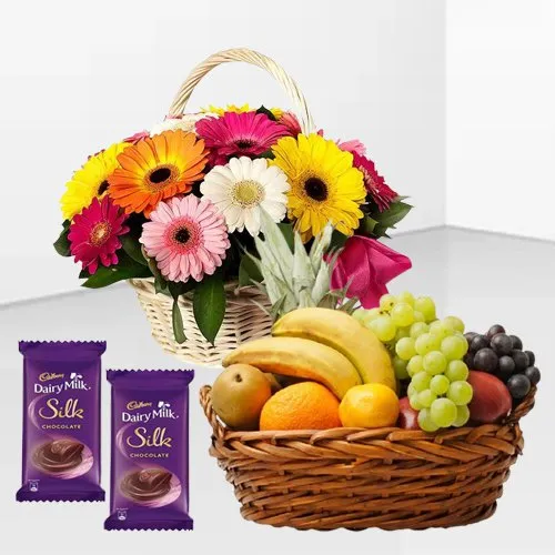 Send Gerberas Arrangement with Mixed Fruits Basket and Dairy Milk Silk