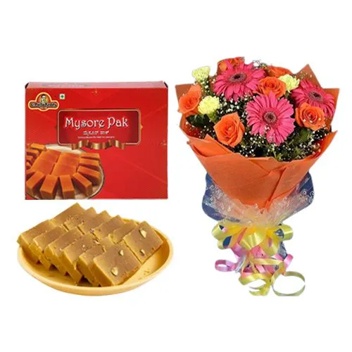 Appetizing Milk Mysorepak from G Pulla Reddy with Seasonal Flower Bouquet