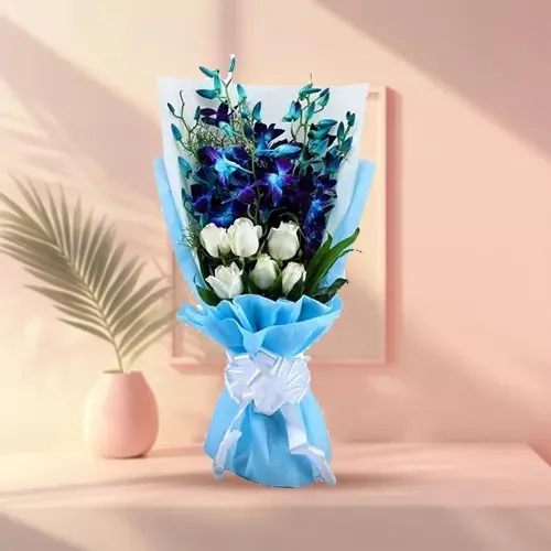 Stunning Tissue Wrapped Bouquet of Blue Orchids N White Roses