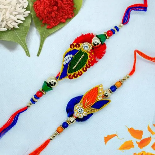 Delightful Zardosi Rakhi Pair with Roli, Chawal n Card