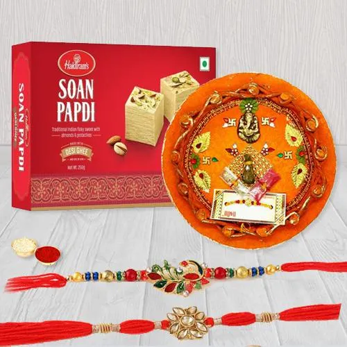 Elegant Pair of Rakhi with Puja Thali N Haldiram Soan Papadi